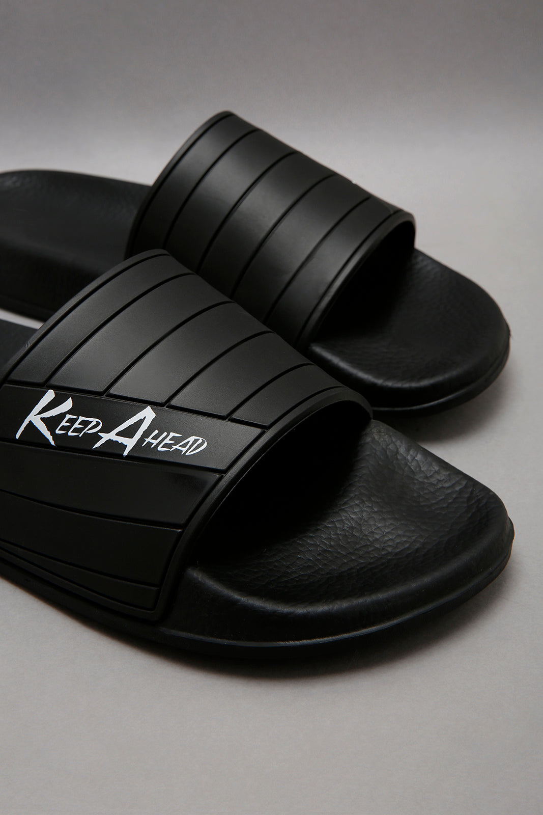 Black Embossed Slide