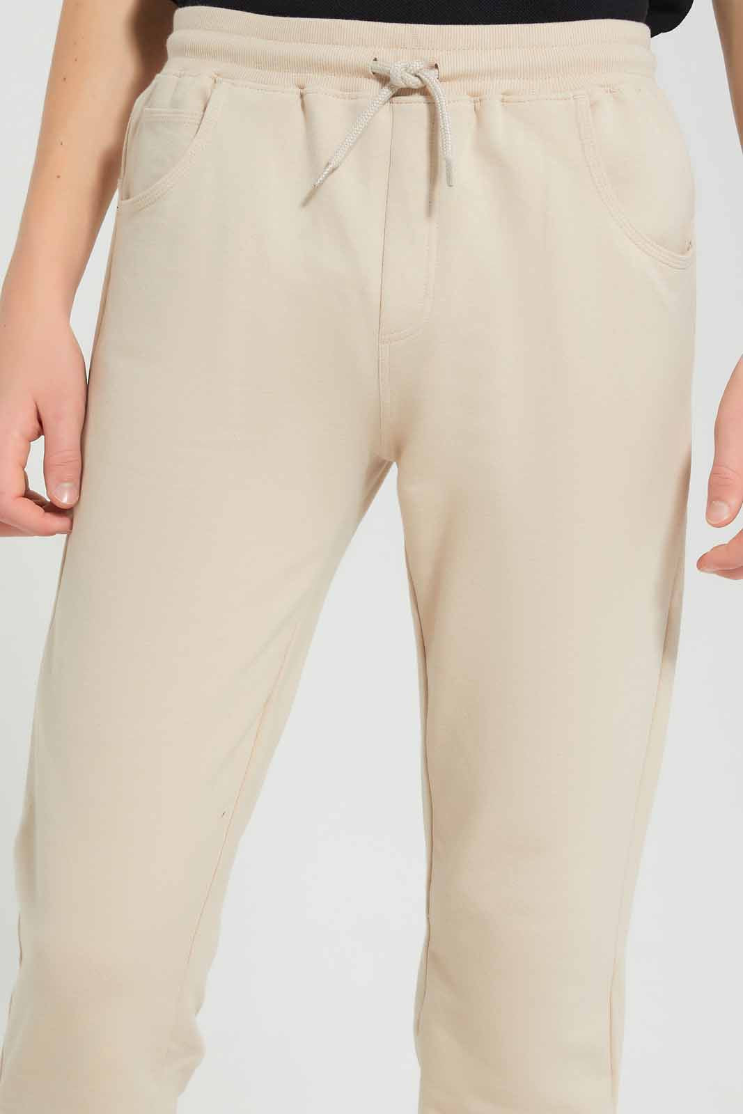 Redtag-Beige-Stretch-Active-Pants-BSR-Joggers,-Category:Joggers,-Colour:Beige,-Deals:New-In,-Filter:Senior-Boys-(8-to-14-Yrs),-New-In-BSR-APL,-Non-Sale,-Section:Boys-(0-to-14Yrs),-W22O-Senior-Boys-9 to 14 Years