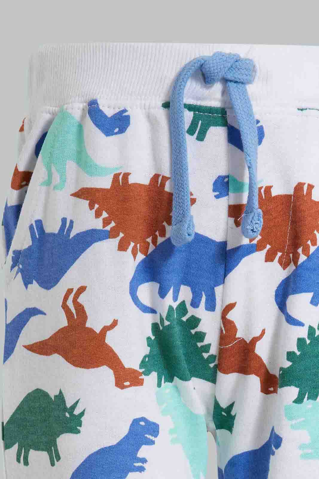 Redtag-White-Dino-Printed-Knit-Jogger-Category:Joggers,-Colour:White,-Deals:New-In,-Filter:Infant-Boys-(3-to-24-Mths),-INB-Joggers,-New-In-INB-APL,-Non-Sale,-Section:Boys-(0-to-14Yrs),-TBL,-W22O-Infant-Boys-3 to 24 Months