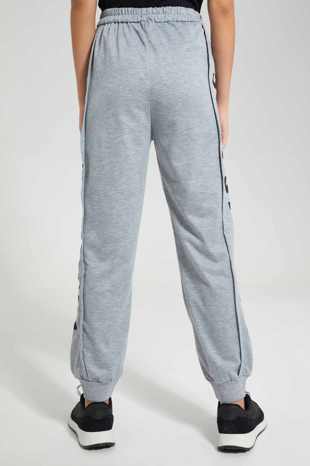 Redtag-Grey-Melange-Track-Pants-With-Print-Category:Joggers,-Colour:Grey,-Deals:New-In,-Filter:Senior-Girls-(9-to-14-Yrs),-GSR-Joggers,-New-In-GSR-APL,-Non-Sale,-Section:Girls-(0-to-14Yrs),-W22O-Senior-Girls-9 to 14 Years