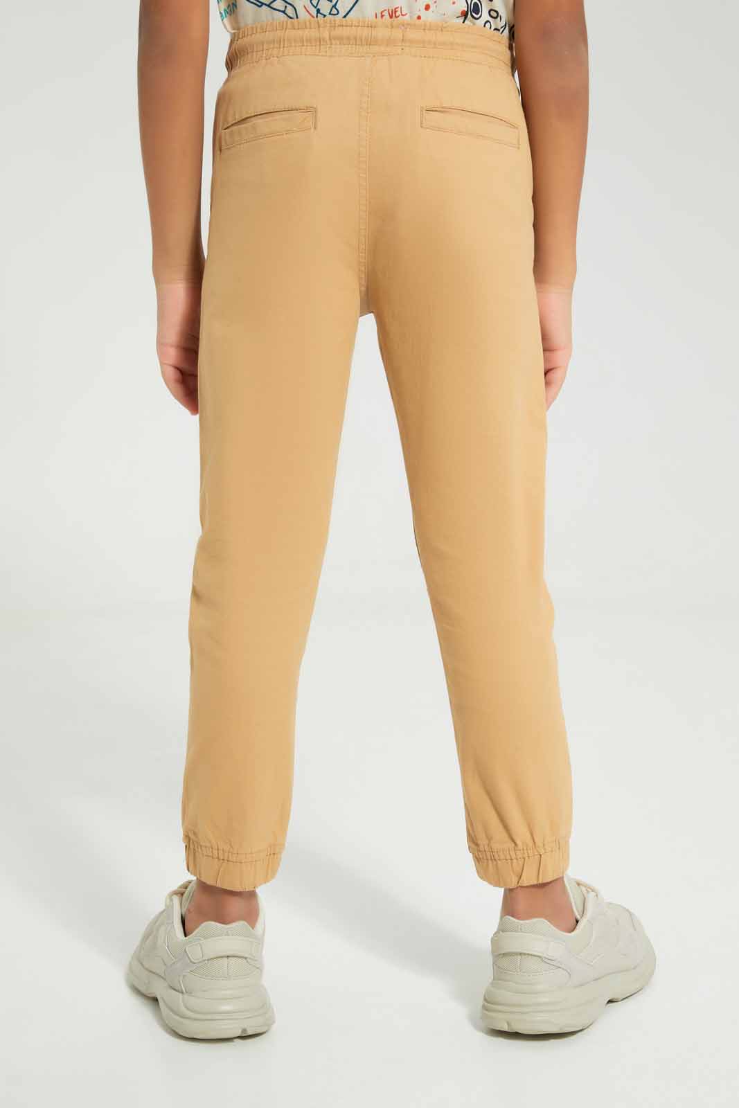 Redtag-Beige-Twill-Stretch-Jogger-BOY-Trousers,-Category:Trousers,-Colour:Beige,-Deals:New-In,-Filter:Boys-(2-to-8-Yrs),-New-In-BOY-APL,-Non-Sale,-Section:Boys-(0-to-14Yrs),-TBL,-W22A-Boys-2 to 8 Years