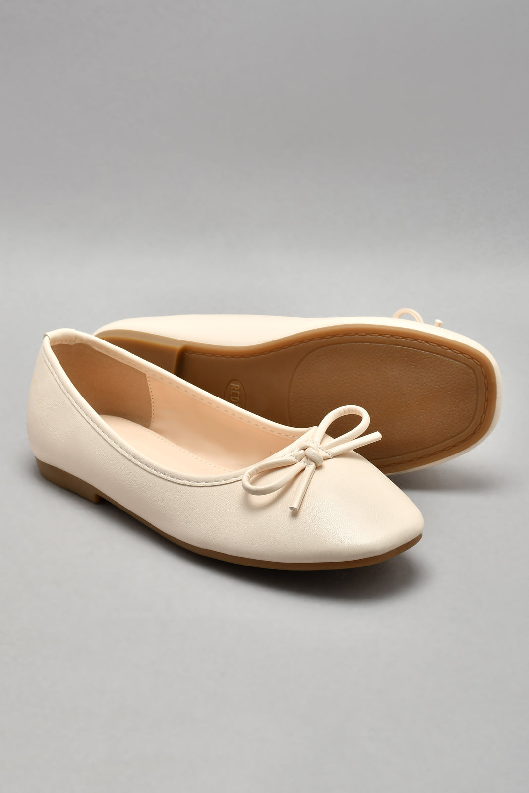Ivory Trim Ballerina With Bow