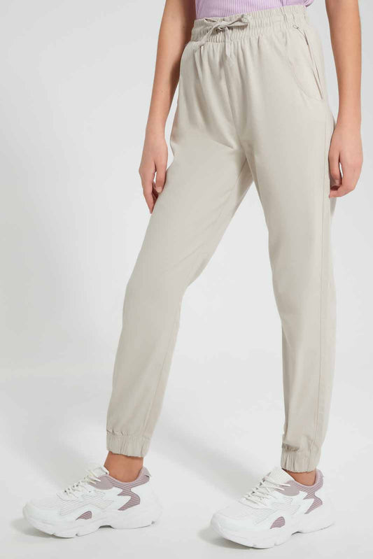 Redtag-Beige-Plain-Twill-Jogger-Category:Trousers,-Colour:Beige,-Filter:Senior-Girls-(9-to-14-Yrs),-GSR-Trousers,-New-In,-New-In-GSR,-Non-Sale,-S22D,-Section:Kidswear,-TBL-Senior-Girls-9 to 14 Years