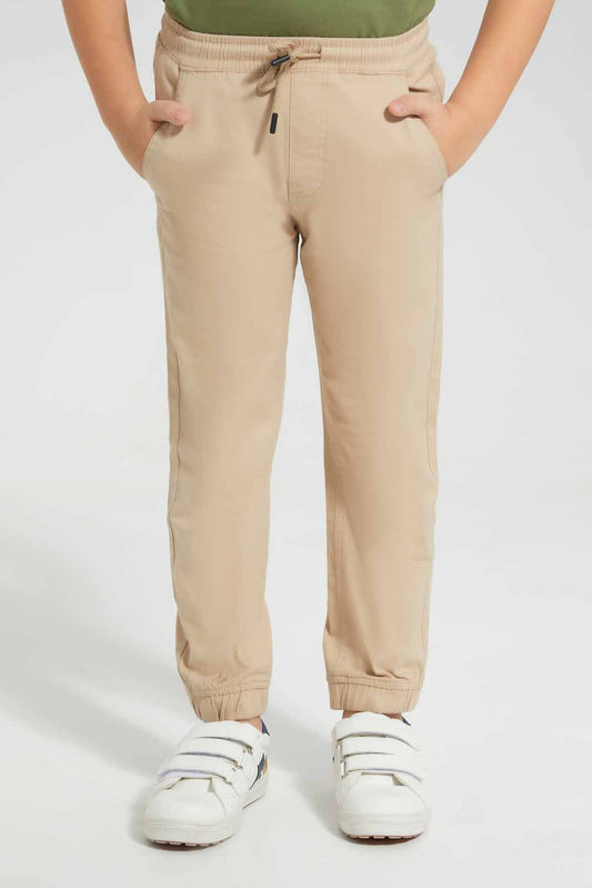 Redtag-Beige-Twill-Stretch-Jogger-BOY-Trousers,-Category:Trousers,-Colour:Beige,-Deals:New-In,-Filter:Boys-(2-to-8-Yrs),-New-In-BOY-APL,-Non-Sale,-Section:Boys-(0-to-14Yrs),-VLM,-W22O-Boys-2 to 8 Years