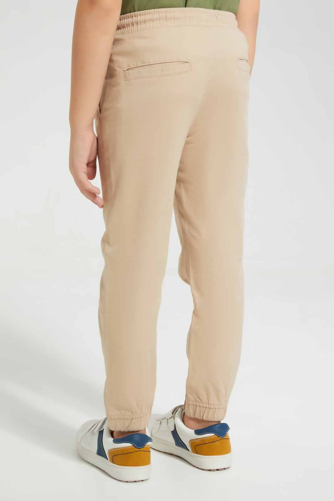 Redtag-Beige-Twill-Stretch-Jogger-BOY-Trousers,-Category:Trousers,-Colour:Beige,-Deals:New-In,-Filter:Boys-(2-to-8-Yrs),-New-In-BOY-APL,-Non-Sale,-Section:Boys-(0-to-14Yrs),-VLM,-W22O-Boys-2 to 8 Years