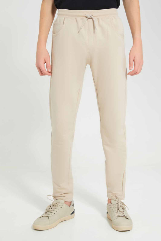 Redtag-Beige-Stretch-Active-Pants-BSR-Joggers,-Category:Joggers,-Colour:Beige,-Deals:New-In,-Filter:Senior-Boys-(8-to-14-Yrs),-New-In-BSR-APL,-Non-Sale,-Section:Boys-(0-to-14Yrs),-W22O-Senior-Boys-9 to 14 Years
