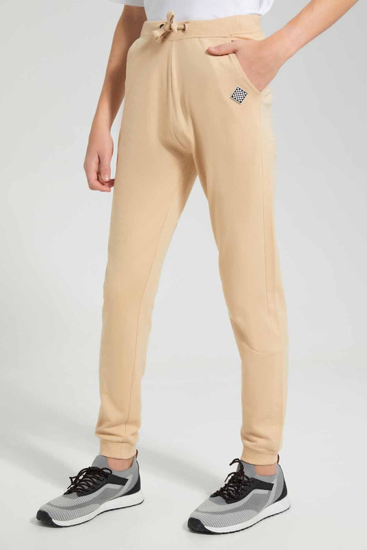 Redtag-Beige-Table-Active-Pant-BSR-Joggers,-Category:Joggers,-Colour:Beige,-Deals:New-In,-Filter:Senior-Boys-(9-to-14-Yrs),-New-In-BSR-APL,-Non-Sale,-Section:Boys-(0-to-14Yrs),-TBL,-W22O-Senior-Boys-9 to 14 Years
