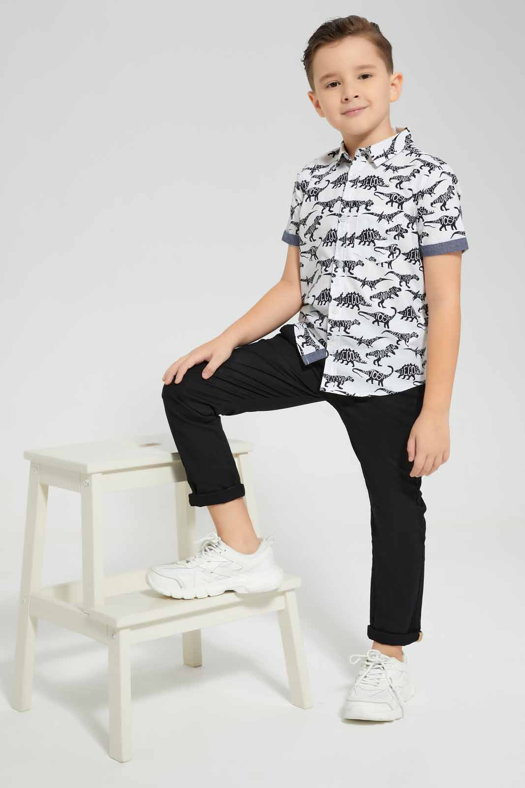 Redtag-White-Dino-Aop-SS-Shirt-BOY-Shirts,-Category:Shirts,-Colour:White,-Deals:New-In,-Filter:Boys-(2-to-8-Yrs),-New-In-BOY-APL,-Non-Sale,-Section:Boys-(0-to-14Yrs),-TBL,-W22O-Boys-2 to 8 Years
