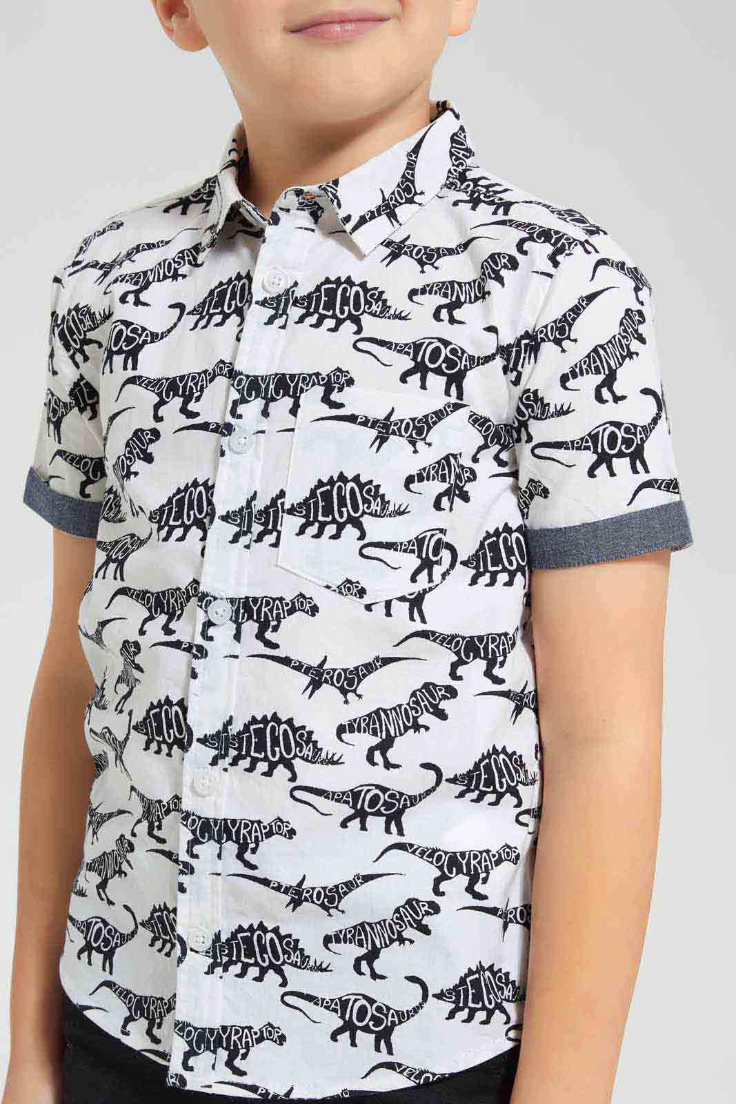 Redtag-White-Dino-Aop-SS-Shirt-BOY-Shirts,-Category:Shirts,-Colour:White,-Deals:New-In,-Filter:Boys-(2-to-8-Yrs),-New-In-BOY-APL,-Non-Sale,-Section:Boys-(0-to-14Yrs),-TBL,-W22O-Boys-2 to 8 Years