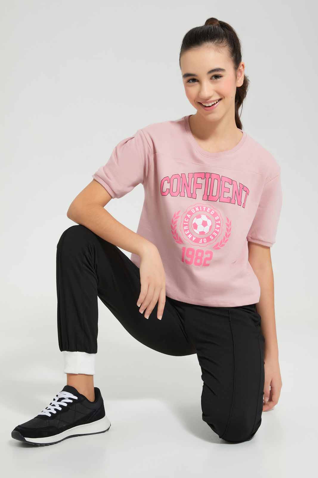 Redtag-Pink-Shortsleeve-Top-Category:T-Shirts,-Colour:Apricot,-Deals:New-In,-Filter:Senior-Girls-(9-to-14-Yrs),-GSR-T-Shirts,-New-In-GSR-APL,-Non-Sale,-Section:Girls-(0-to-14Yrs),-TBL,-W22O-Senior-Girls-9 to 14 Years