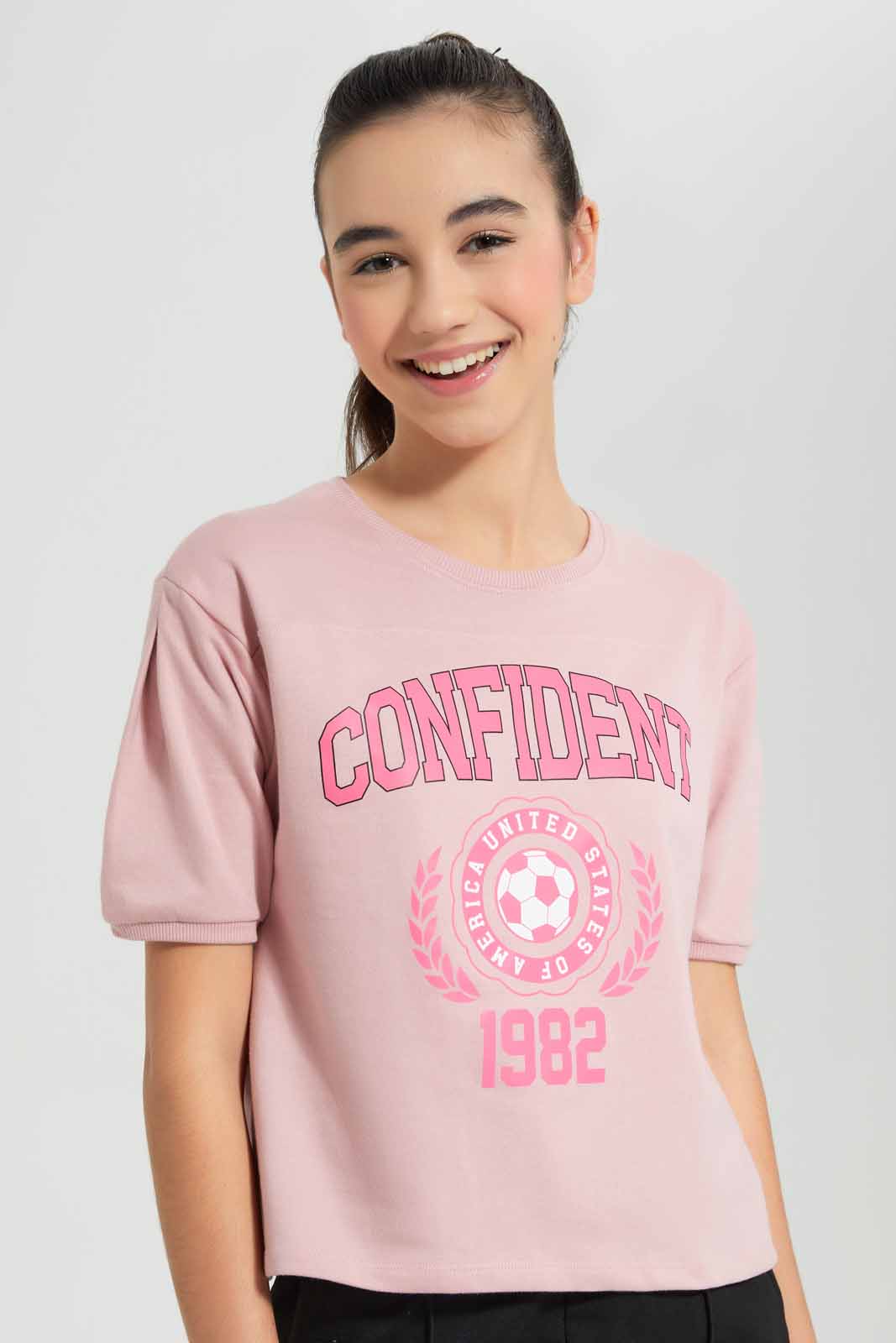 Redtag-Pink-Shortsleeve-Top-Category:T-Shirts,-Colour:Apricot,-Deals:New-In,-Filter:Senior-Girls-(9-to-14-Yrs),-GSR-T-Shirts,-New-In-GSR-APL,-Non-Sale,-Section:Girls-(0-to-14Yrs),-TBL,-W22O-Senior-Girls-9 to 14 Years