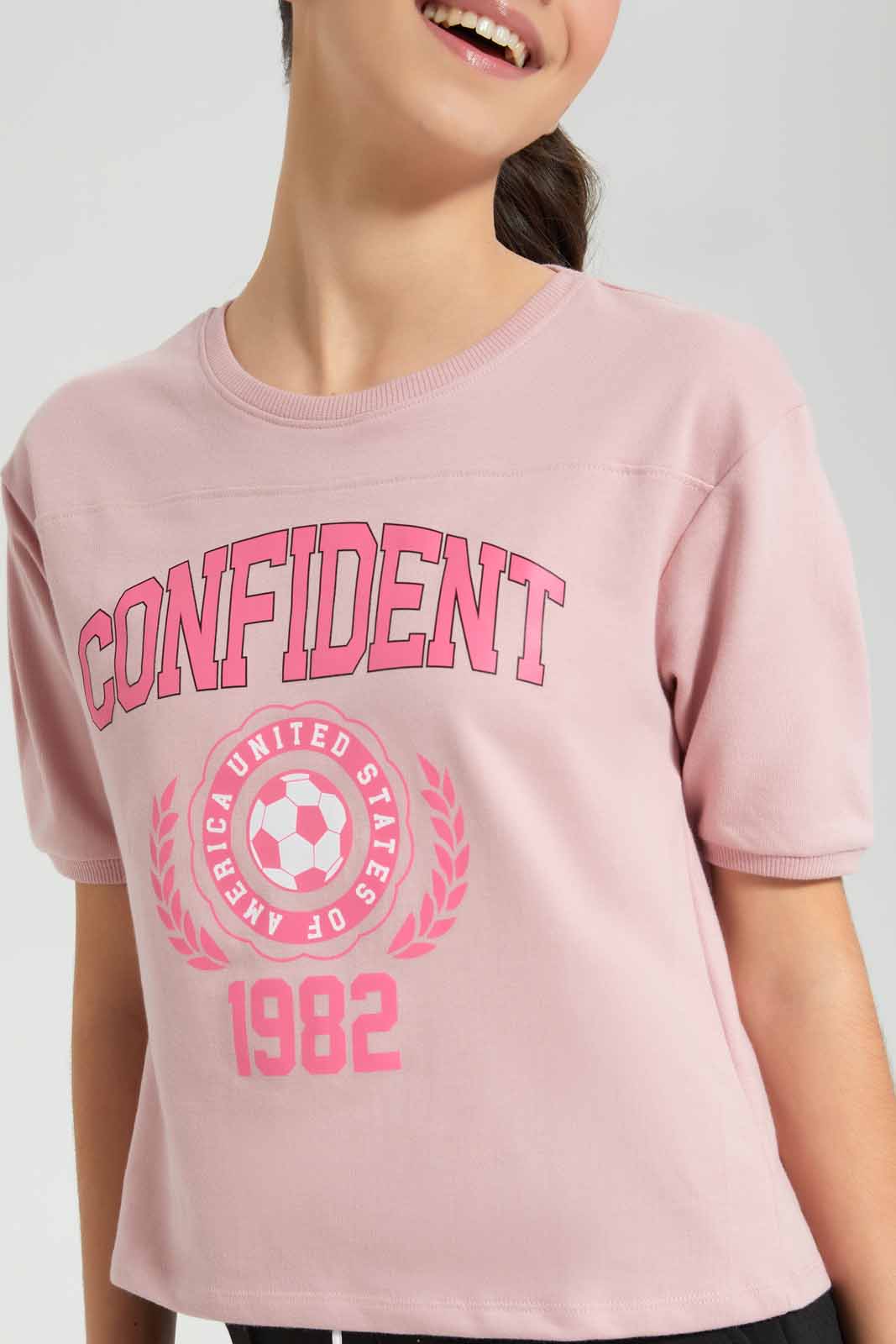 Redtag-Pink-Shortsleeve-Top-Category:T-Shirts,-Colour:Apricot,-Deals:New-In,-Filter:Senior-Girls-(9-to-14-Yrs),-GSR-T-Shirts,-New-In-GSR-APL,-Non-Sale,-Section:Girls-(0-to-14Yrs),-TBL,-W22O-Senior-Girls-9 to 14 Years