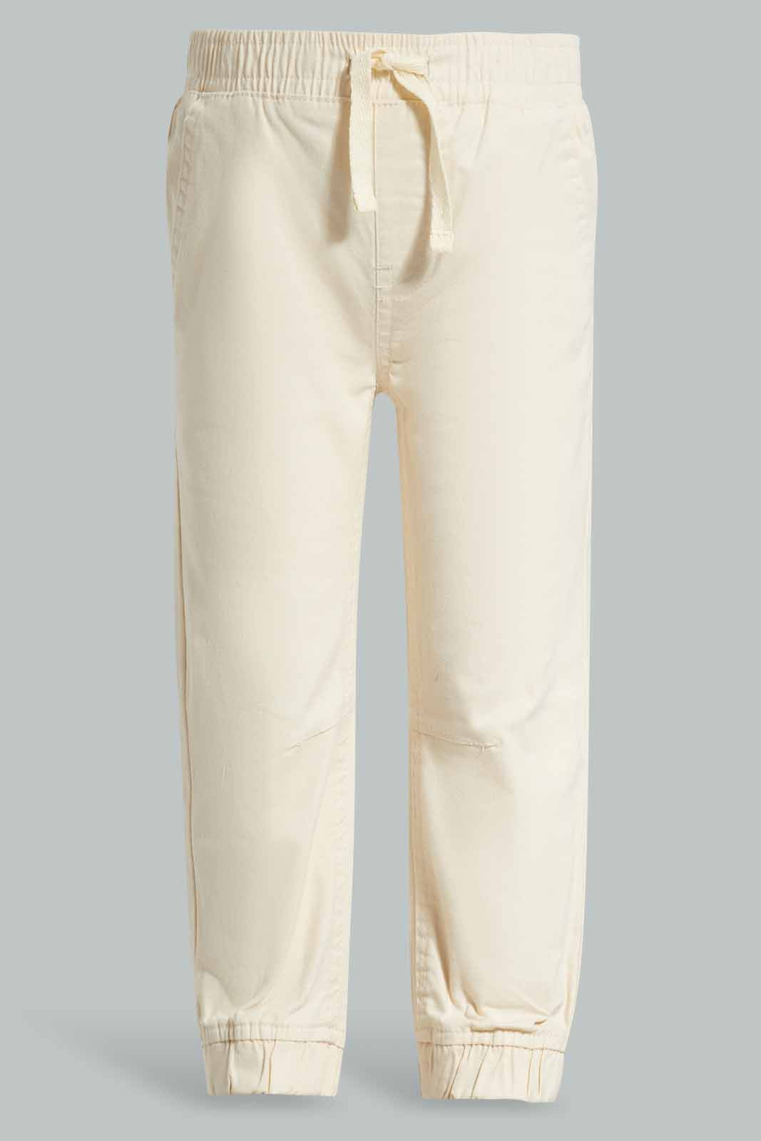 Redtag-Cream-Chino-Jogger-Category:Trousers,-Colour:Cream,-Deals:New-In,-Filter:Infant-Boys-(3-to-24-Mths),-INB-Trousers,-New-In-INB-APL,-Non-Sale,-Section:Boys-(0-to-14Yrs),-W22A-Infant-Boys-3 to 24 Months
