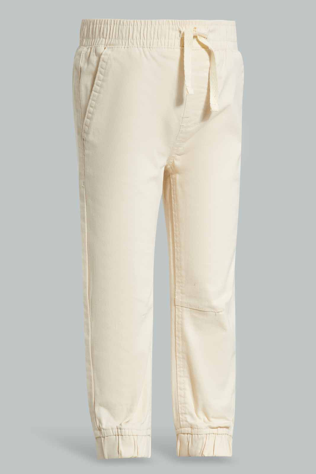 Redtag-Cream-Chino-Jogger-Category:Trousers,-Colour:Cream,-Deals:New-In,-Filter:Infant-Boys-(3-to-24-Mths),-INB-Trousers,-New-In-INB-APL,-Non-Sale,-Section:Boys-(0-to-14Yrs),-W22A-Infant-Boys-3 to 24 Months