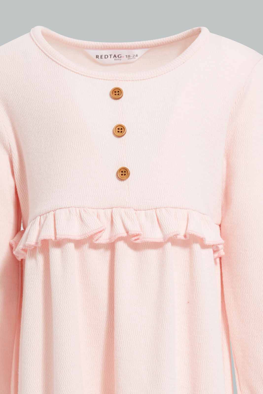 Redtag-Pink-Solid-Textured-Fabric-Dress-Category:Dresses,-Colour:Apricot,-Deals:New-In,-Filter:Infant-Girls-(3-to-24-Mths),-ING-Dresses,-New-In-ING-APL,-Non-Sale,-Section:Girls-(0-to-14Yrs),-W22A-Infant-Girls-3 to 24 Months