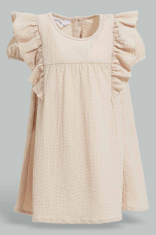Redtag-Beige-Solid-Textured-Fabric-Dress-Category:Dresses,-Colour:Beige,-Deals:New-In,-Filter:Infant-Girls-(3-to-24-Mths),-ING-Dresses,-New-In-ING-APL,-Non-Sale,-Section:Girls-(0-to-14Yrs),-W22A-Infant-Girls-3 to 24 Months