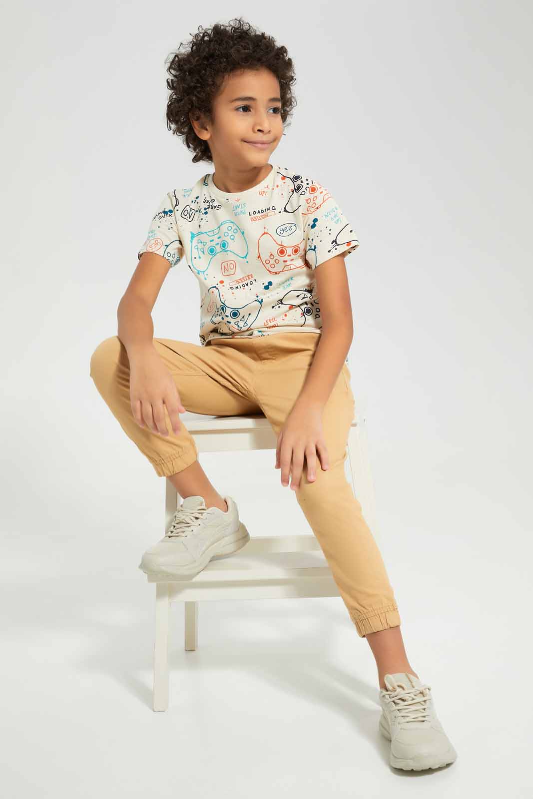 Redtag-Beige-Game-All-Over-Print-T-shirt-BOY-T-Shirts,-Category:T-Shirts,-Colour:Beige,-Deals:New-In,-Filter:Boys-(2-to-8-Yrs),-New-In-BOY-APL,-Non-Sale,-Section:Boys-(0-to-14Yrs),-TBL,-W22A-Boys-2 to 8 Years