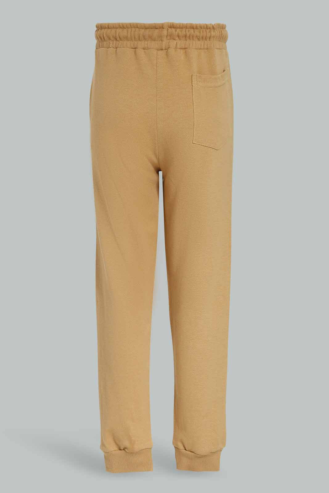 Redtag-Brown-Pique-Pant-BOY-Joggers,-Category:Joggers,-Colour:Brown,-Deals:New-In,-Dept:Boys,-Filter:Boys-(2-to-8-Yrs),-New-In-BOY-APL,-Non-Sale,-Section:Boys-(0-to-14Yrs),-TBL,-W22A-Boys-2 to 8 Years