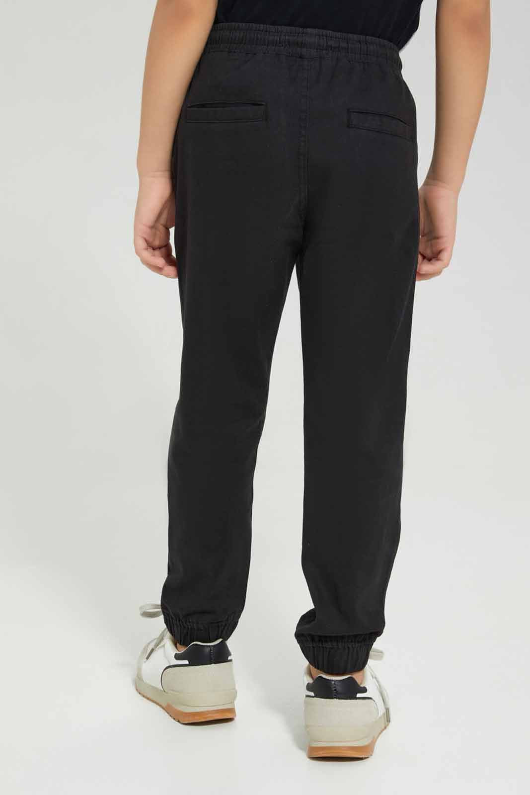 Redtag-Black-Twill-Stretch-Jogger-BOY-Trousers,-BTS,-Category:Trousers,-Colour:Black,-Deals:New-In,-Filter:Boys-(2-to-8-Yrs),-New-In-BOY-APL,-Non-Sale,-Section:Boys-(0-to-14Yrs),-TBL,-W22B-Boys-2 to 8 Years