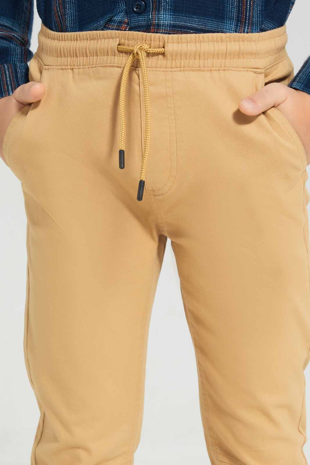 Redtag-Beige-Twill-Stretch-Jogger-BOY-Trousers,-Category:Trousers,-Colour:Beige,-Deals:New-In,-Filter:Boys-(2-to-8-Yrs),-New-In-BOY-APL,-Non-Sale,-Section:Boys-(0-to-14Yrs),-TBL,-W22B-Boys-2 to 8 Years