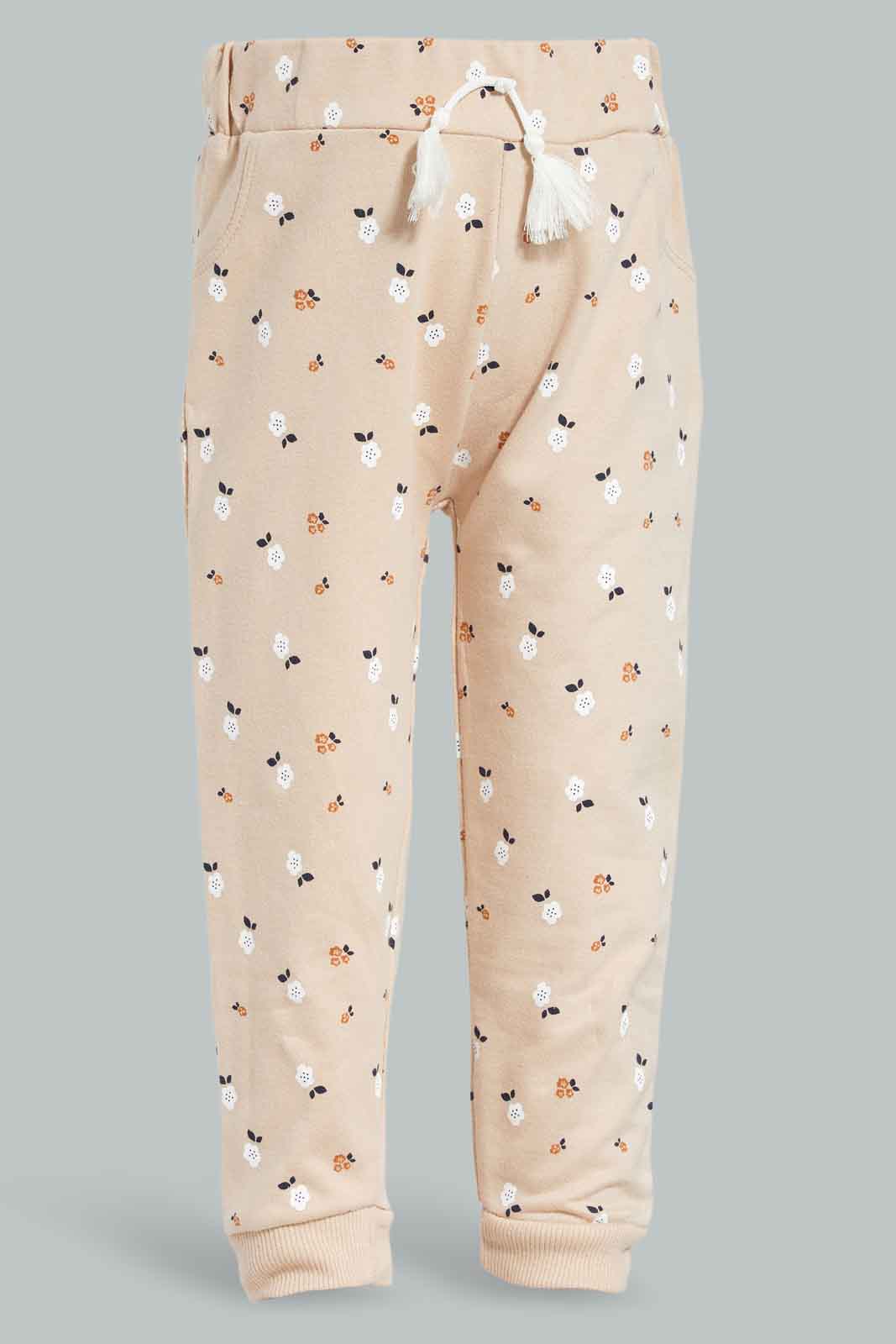 Redtag-Beige-Floral-AOP-Trackpant-Category:Joggers,-Colour:Beige,-Deals:New-In,-Filter:Infant-Girls-(3-to-24-Mths),-ING-Joggers,-New-In-ING-APL,-Non-Sale,-Section:Girls-(0-to-14Yrs),-TBL,-W22B-Infant-Girls-3 to 24 Months