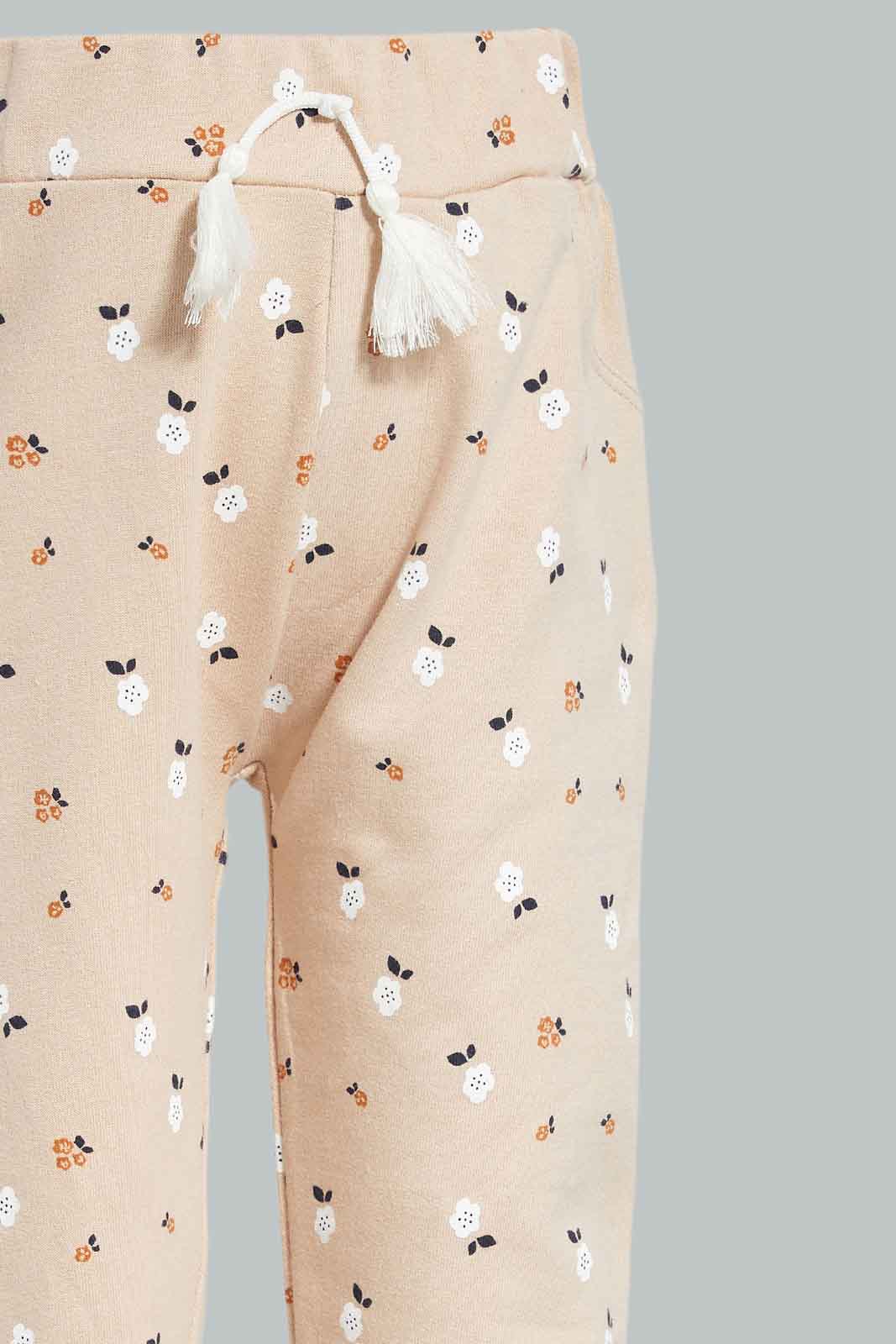 Redtag-Beige-Floral-AOP-Trackpant-Category:Joggers,-Colour:Beige,-Deals:New-In,-Filter:Infant-Girls-(3-to-24-Mths),-ING-Joggers,-New-In-ING-APL,-Non-Sale,-Section:Girls-(0-to-14Yrs),-TBL,-W22B-Infant-Girls-3 to 24 Months