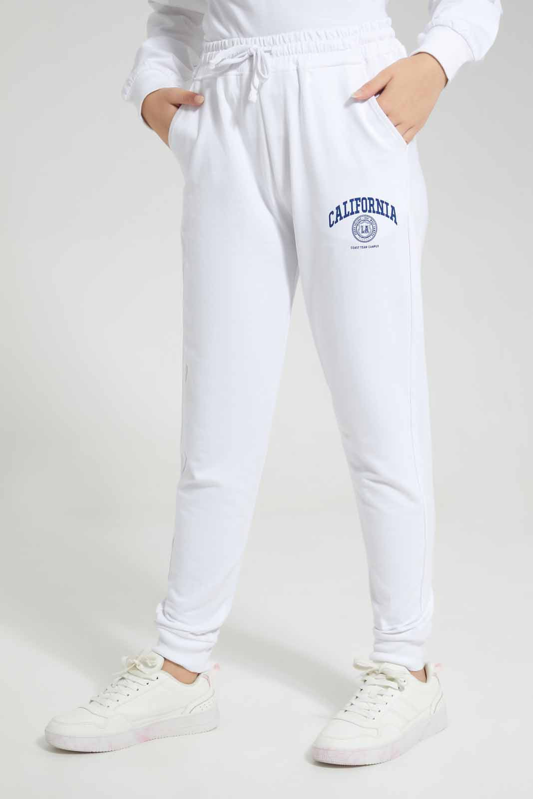 Redtag-White-Track-Pants-With-Print-Category:Joggers,-Colour:White,-Deals:New-In,-Filter:Senior-Girls-(8-to-14-Yrs),-GSR-Joggers,-New-In-GSR-APL,-Non-Sale,-Section:Girls-(0-to-14Yrs),-W22A-Senior-Girls-9 to 14 Years
