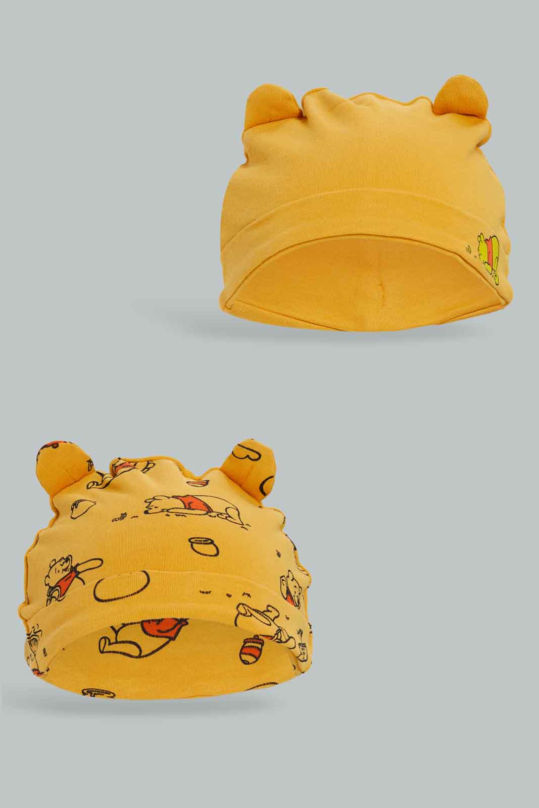 Redtag-2PC-Winnie-The-Pooh-Cap-Pack-Category:Newborn-Accessories,-CHR,-Colour:Yellow,-Deals:New-In,-Dept:New-Born,-Filter:Baby-(0-to-12-Mths),-NBB-Newborn-Accessories,-New-In-NBB-APL,-Non-Sale,-Section:Boys-(0-to-14Yrs),-W22B-Baby-0 to 12 Months