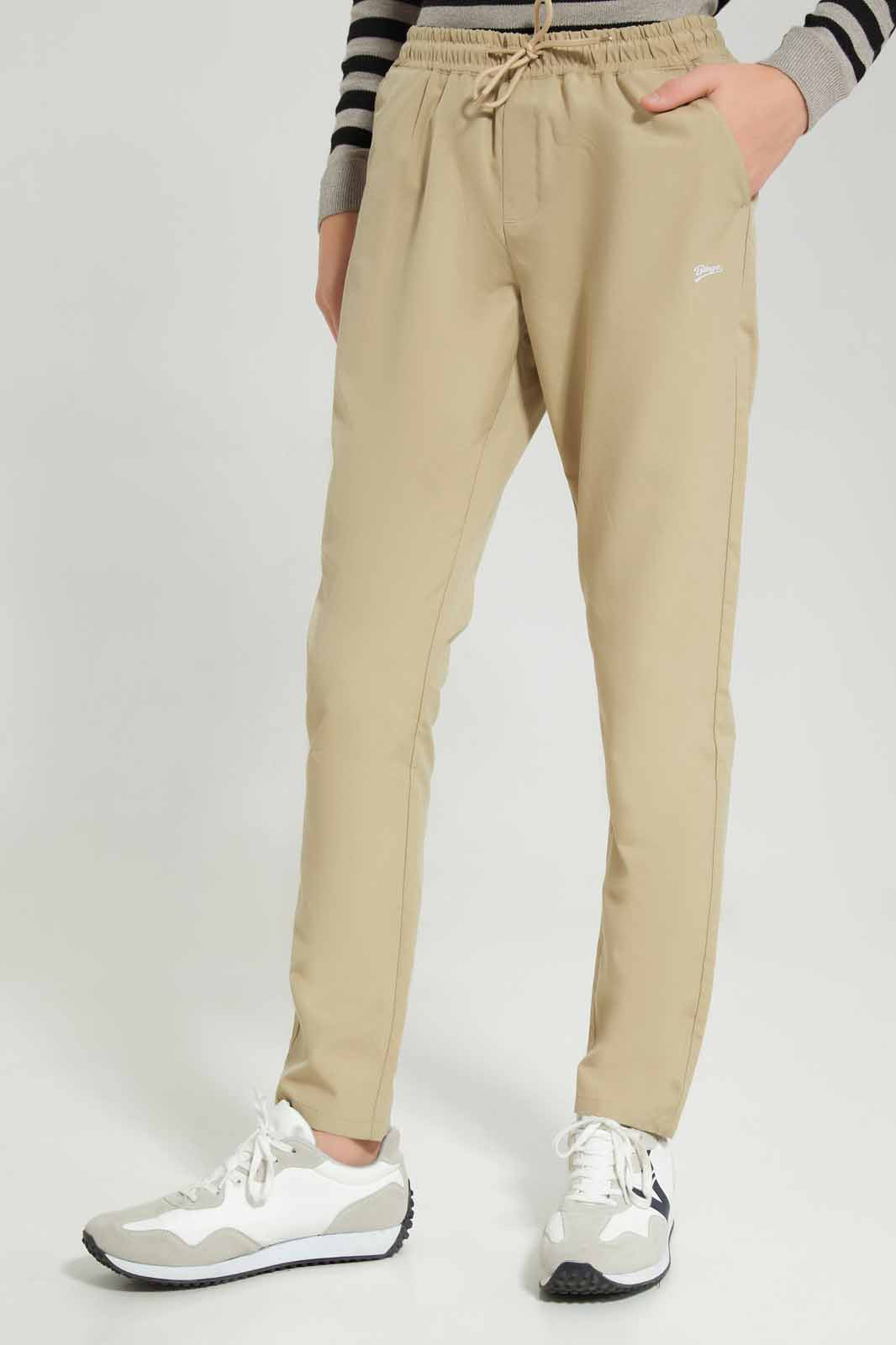 Redtag-Beige-Plain-Pull-On-Casual-Trouser-BSR-Trousers,-Category:Trousers,-Colour:Beige,-Deals:New-In,-Dept:Boys,-Filter:Senior-Boys-(8-to-14-Yrs),-New-In-BSR-APL,-Non-Sale,-Section:Boys-(0-to-14Yrs),-W22B-Senior-Boys-9 to 14 Years