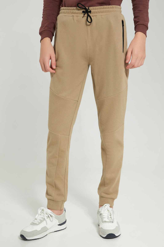 Redtag-Boys-Beige-Biker-Knee-Active-Pants-With-Zip-BSR-Joggers,-Category:Joggers,-Colour:Beige,-Deals:New-In,-Filter:Senior-Boys-(8-to-14-Yrs),-New-In-BSR-APL,-Non-Sale,-Section:Boys-(0-to-14Yrs),-W22B-Senior-Boys-9 to 14 Years