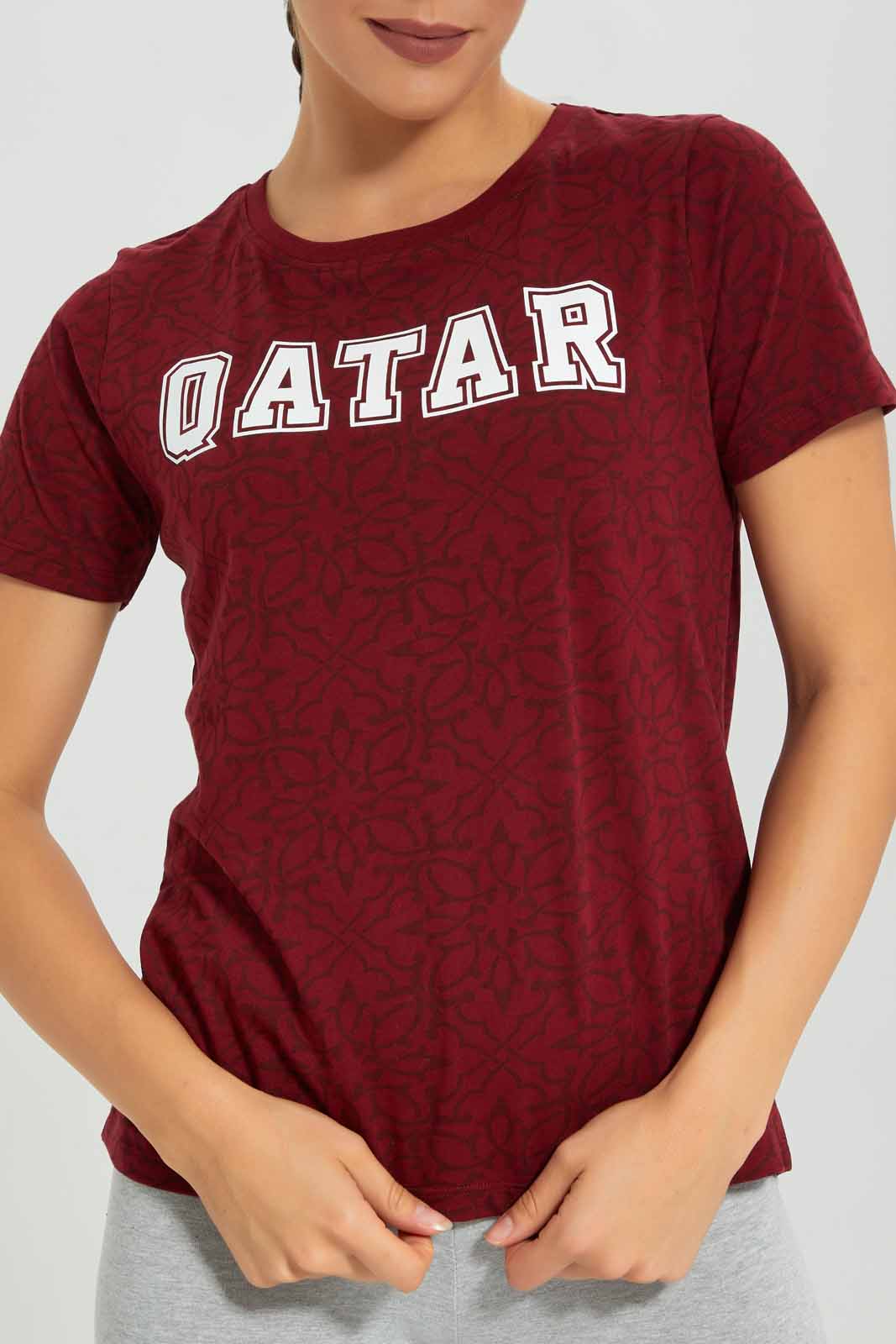 Redtag-Women-Burgandy-Qatar-Placement-Print-Active-T-Shirt-Category:T-Shirts,-Colour:Burgundy,-Deals:New-In,-Filter:Women's-Clothing,-FWC,-New-In-Women-APL,-Non-Sale,-Section:Women,-W22B,-Women-T-Shirts-Women's-