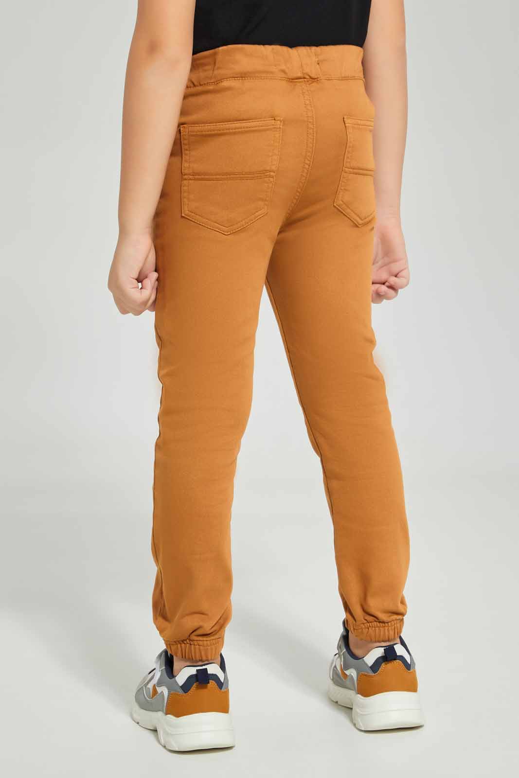 Redtag-Boys-Brown-Knit-Denim-Jogger-BOY-Jeans,-Category:Jeans,-Colour:Brown,-Deals:New-In,-Dept:Boys,-Filter:Boys-(2-to-8-Yrs),-New-In-BOY-APL,-Non-Sale,-Section:Boys-(0-to-14Yrs),-W22B-Boys-2 to 8 Years