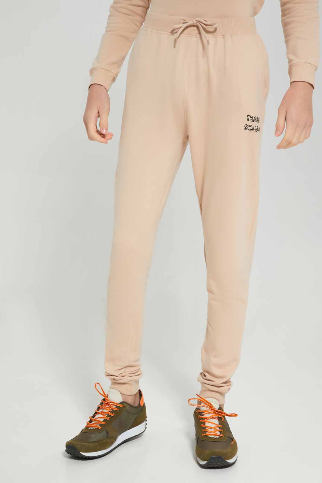 Redtag-Boys-Beige-Nyc-Jogging-Suit-BSR-Jog-Sets,-Category:Jog-Sets,-Colour:Beige,-Deals:New-In,-Filter:Senior-Boys-(8-to-14-Yrs),-New-In-BSR-APL,-Non-Sale,-Section:Boys-(0-to-14Yrs),-W22B-Senior-Boys-9 to 14 Years