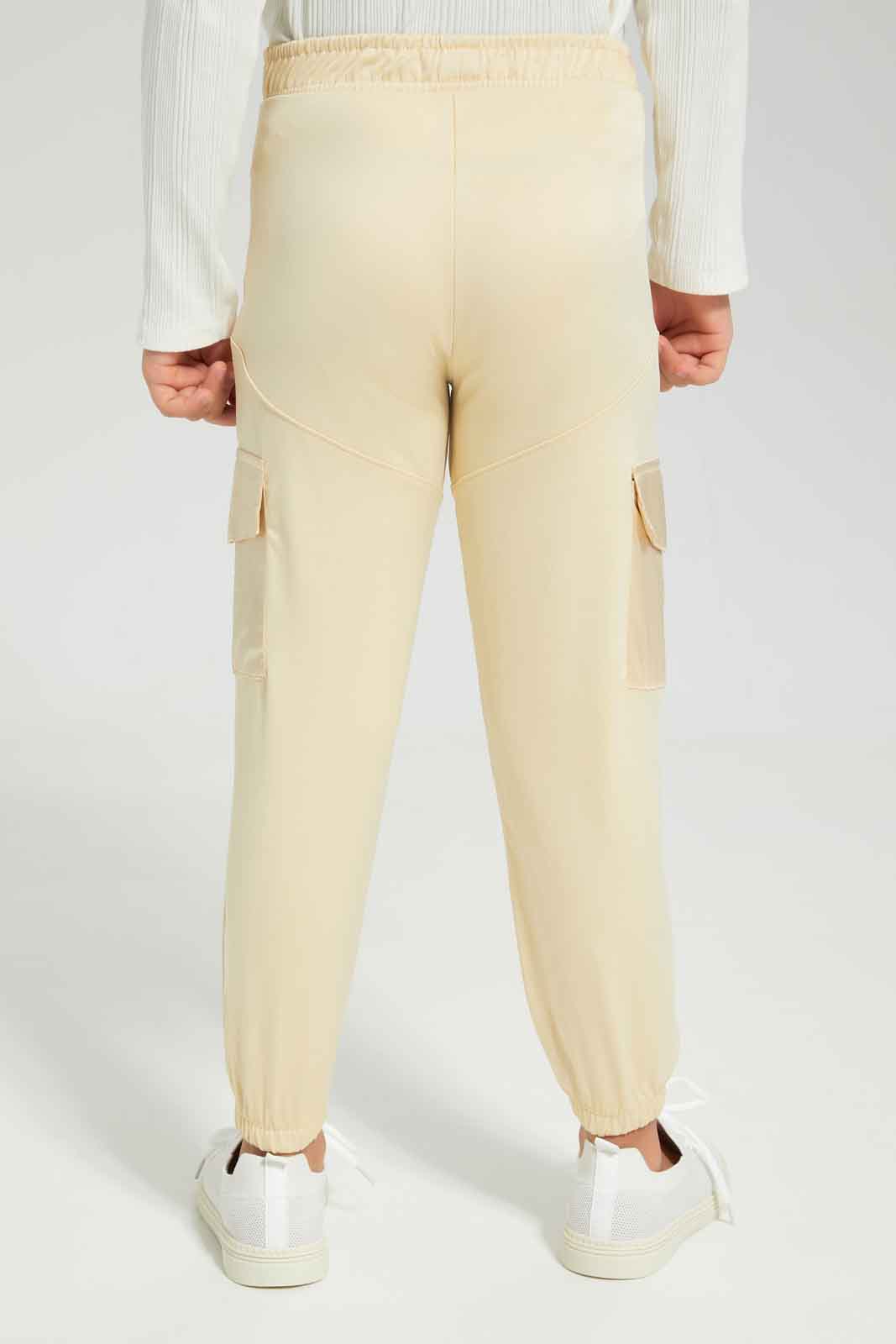 Redtag-Girls-Beige-Aop-Active-Pant-Category:Joggers,-Colour:Beige,-Deals:New-In,-Dept:Girls,-Filter:Girls-(2-to-8-Yrs),-GIR-Joggers,-New-In-GIR-APL,-Non-Sale,-Section:Girls-(0-to-14Yrs),-W22B-Girls-2 to 8 Years