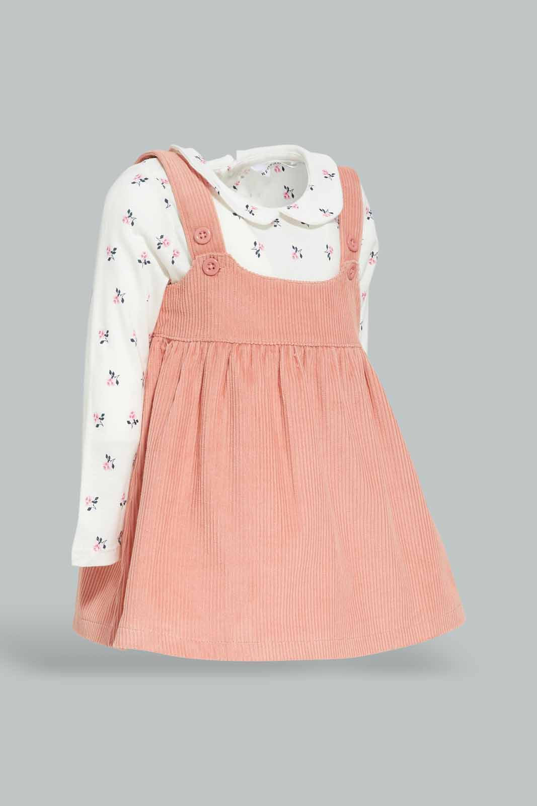 Redtag-Girls-Dusty-Pink-Dungree-Dress-With-Ivory-Aop-T-Shirt-Category:Sets,-Colour:Apricot,-Deals:New-In,-Dept:Girls,-Filter:Infant-Girls-(3-to-24-Mths),-ING-Sets,-New-In-ING-APL,-Non-Sale,-Section:Girls-(0-to-14Yrs),-W22B-Infant-Girls-3 to 24 Months