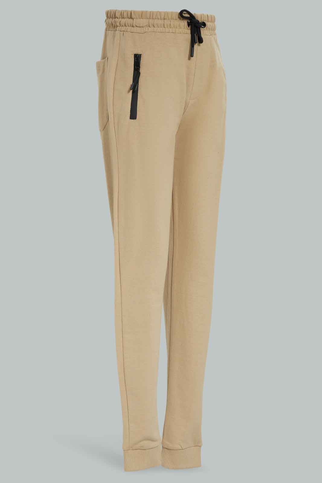 Redtag-Boys-Beige-Heatseal-Zip-Active-Pants-BSR-Joggers,-Category:Joggers,-Colour:Beige,-Deals:New-In,-Dept:Boys,-Filter:Senior-Boys-(8-to-14-Yrs),-New-In-BSR-APL,-Non-Sale,-Section:Boys-(0-to-14Yrs),-W22B-Senior-Boys-9 to 14 Years