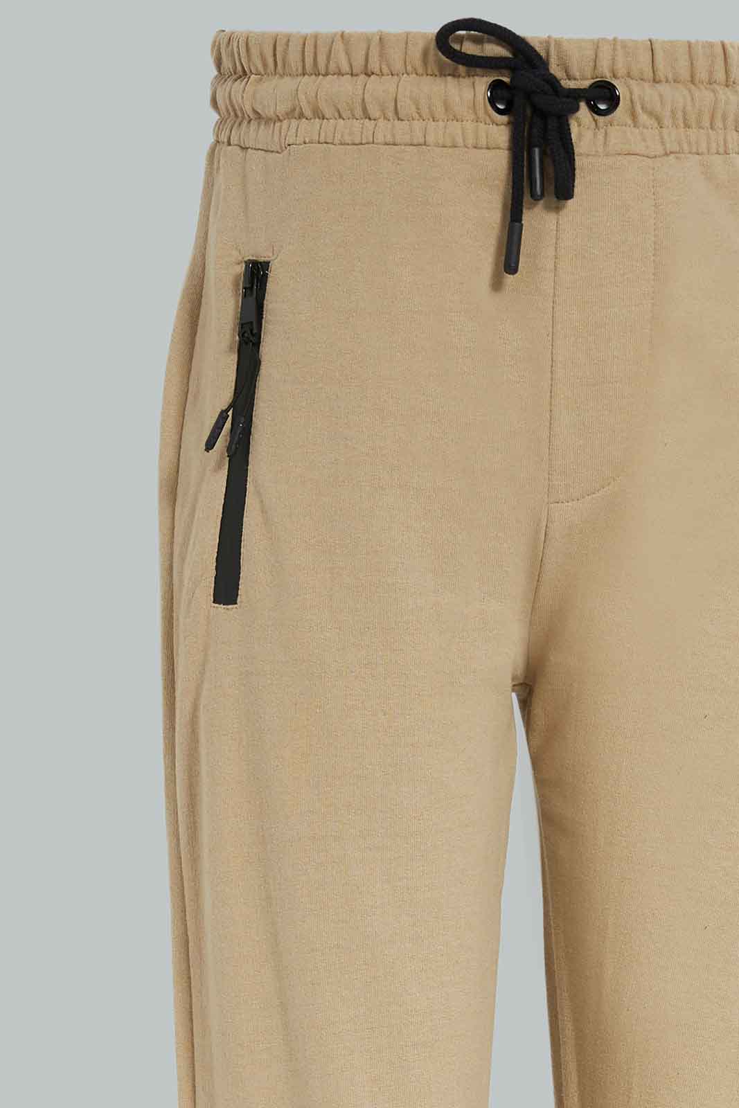 Redtag-Boys-Beige-Heatseal-Zip-Active-Pants-BSR-Joggers,-Category:Joggers,-Colour:Beige,-Deals:New-In,-Dept:Boys,-Filter:Senior-Boys-(8-to-14-Yrs),-New-In-BSR-APL,-Non-Sale,-Section:Boys-(0-to-14Yrs),-W22B-Senior-Boys-9 to 14 Years