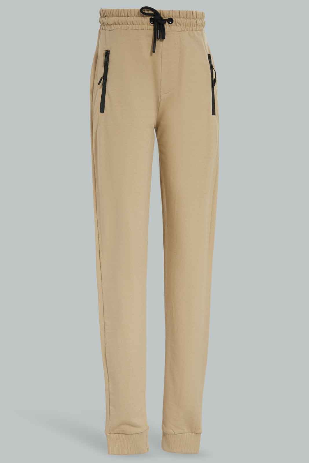 Redtag-Boys-Beige-Heatseal-Zip-Active-Pants-BSR-Joggers,-Category:Joggers,-Colour:Beige,-Deals:New-In,-Dept:Boys,-Filter:Senior-Boys-(8-to-14-Yrs),-New-In-BSR-APL,-Non-Sale,-Section:Boys-(0-to-14Yrs),-W22B-Senior-Boys-9 to 14 Years