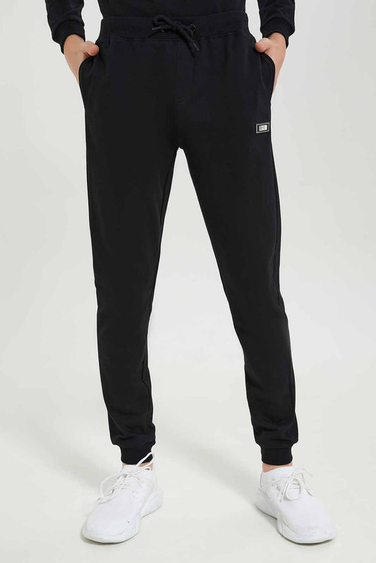 Redtag-Boys-Black-Lounge-Wear-Active-Pants-BSR-Joggers,-Category:Joggers,-Colour:Black,-Deals:New-In,-Dept:Boys,-Filter:Senior-Boys-(8-to-14-Yrs),-New-In-BSR-APL,-Non-Sale,-S23A,-Section:Boys-(0-to-14Yrs)-Senior-Boys-9 to 14 Years