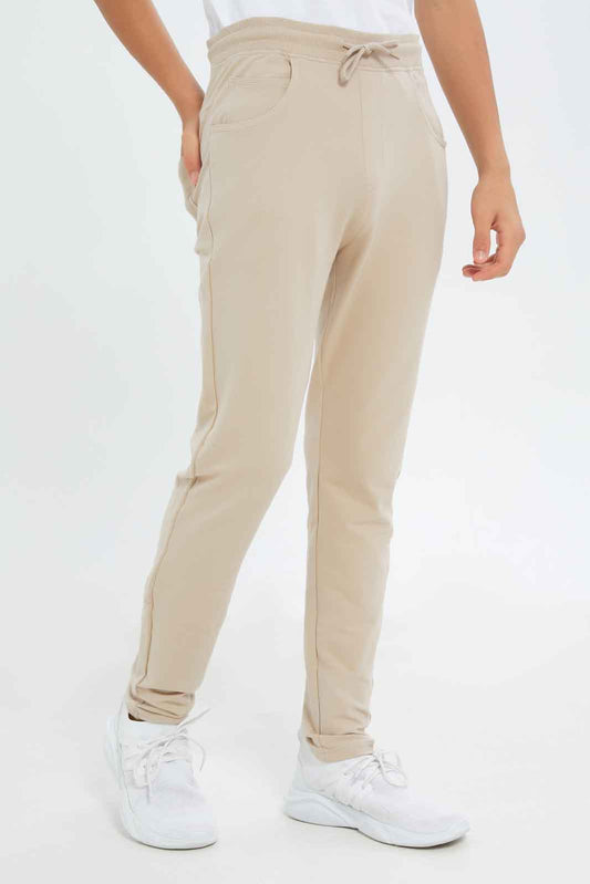 Redtag-Boys-Beige-Stretch-Active-Pants-BSR-Joggers,-Category:Joggers,-Colour:Beige,-Deals:New-In,-Dept:Boys,-Filter:Senior-Boys-(8-to-14-Yrs),-New-In-BSR-APL,-Non-Sale,-S23A,-Section:Boys-(0-to-14Yrs),-VLM-Senior-Boys-9 to 14 Years