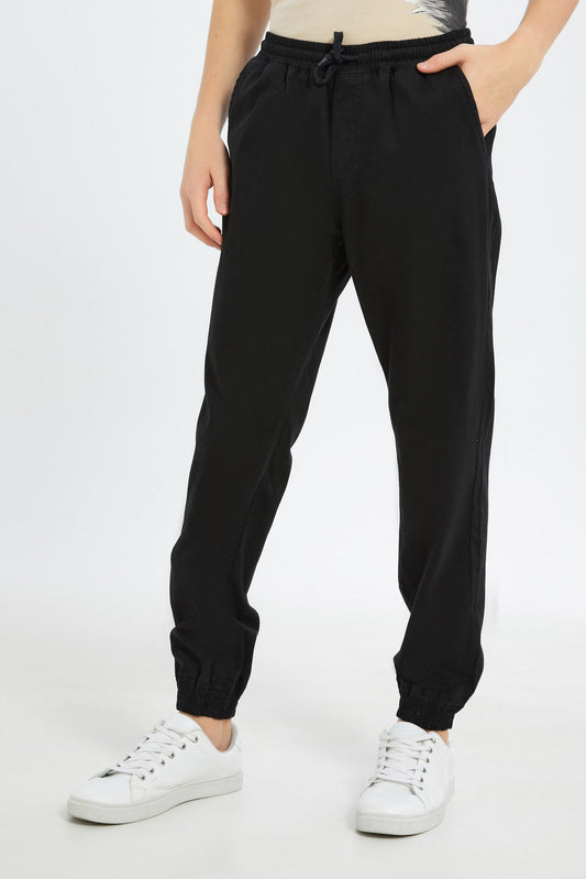 Redtag-Boys-Black-Pull-On-Jogger-BSR-Trousers,-BTS,-Category:Trousers,-Colour:Black,-Deals:2-FOR-89,-Deals:New-In,-Dept:Boys,-Filter:Senior-Boys-(8-to-14-Yrs),-H1:KWR,-H2:BSR,-H3:TRS,-H4:CTR,-New-In-BSR-APL,-Non-Sale,-S23B,-Season:S23B,-Section:Boys-(0-to-14Yrs),-TBL-Senior-Boys-9 to 14 Years