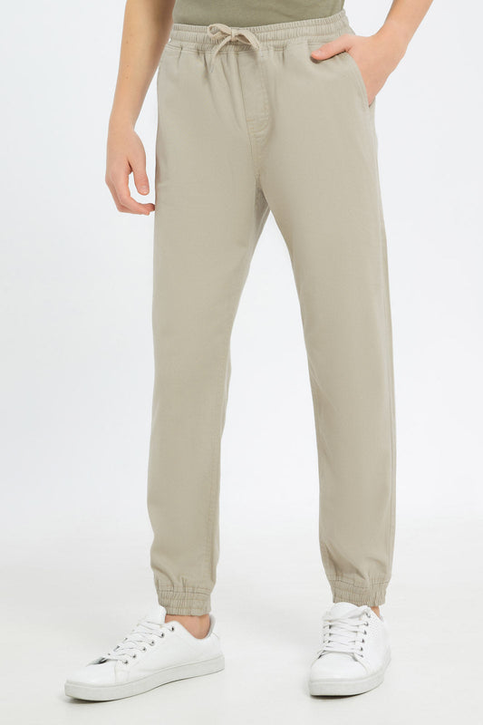 Redtag-Boys-Beige-Pull-On-Jogger-BSR-Trousers,-Category:Trousers,-Colour:Beige,-Deals:2-FOR-89,-Deals:New-In,-Dept:Boys,-Filter:Senior-Boys-(8-to-14-Yrs),-H1:KWR,-H2:BSR,-H3:TRS,-H4:CTR,-New-In-BSR-APL,-Non-Sale,-S23B,-Season:S23B,-Section:Boys-(0-to-14Yrs),-TBL-Senior-Boys-9 to 14 Years