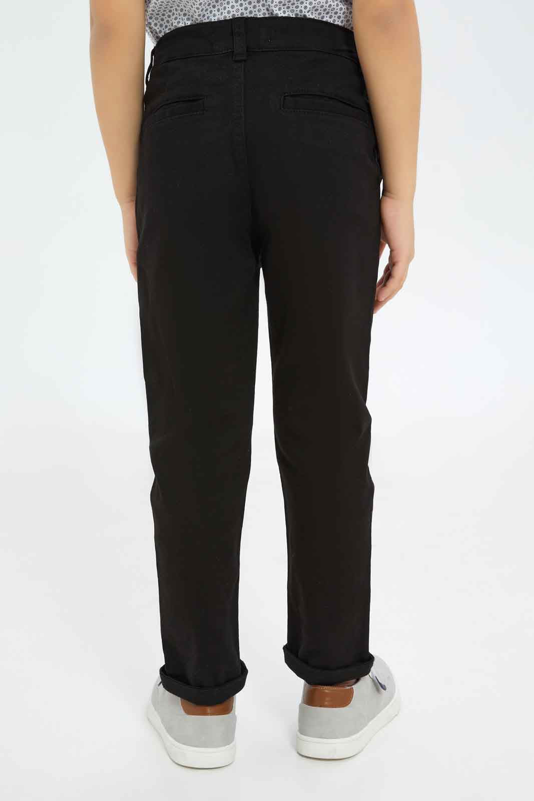 Redtag-Boys-Black-Chino-Trouser-BOY-Trousers,-BTS,-Category:Trousers,-Colour:Black,-Deals:New-In,-Dept:Boys,-Filter:Boys-(2-to-8-Yrs),-New-In-BOY-APL,-Non-Sale,-S23B,-Section:Boys-(0-to-14Yrs),-VLM-Boys-2 to 8 Years