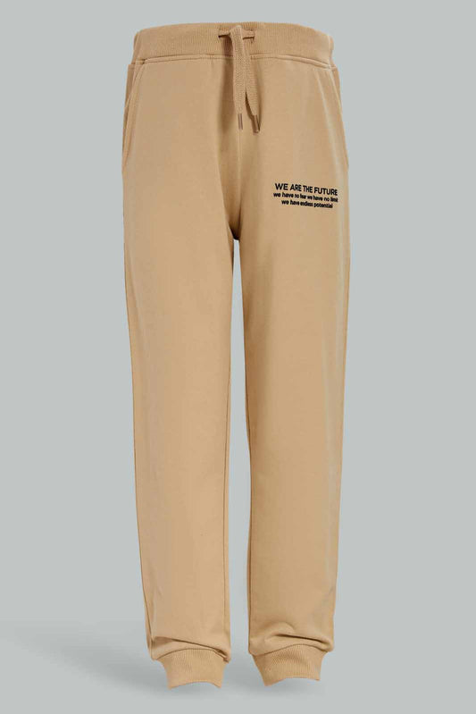 Redtag-Boys-Beige-Jogpant-With-Print-BOY-Joggers,-Category:Joggers,-Colour:Beige,-Deals:New-In,-Dept:Boys,-Filter:Boys-(2-to-8-Yrs),-New-In-BOY-APL,-Non-Sale,-S23A,-Section:Boys-(0-to-14Yrs),-TBL-Boys-2 to 8 Years