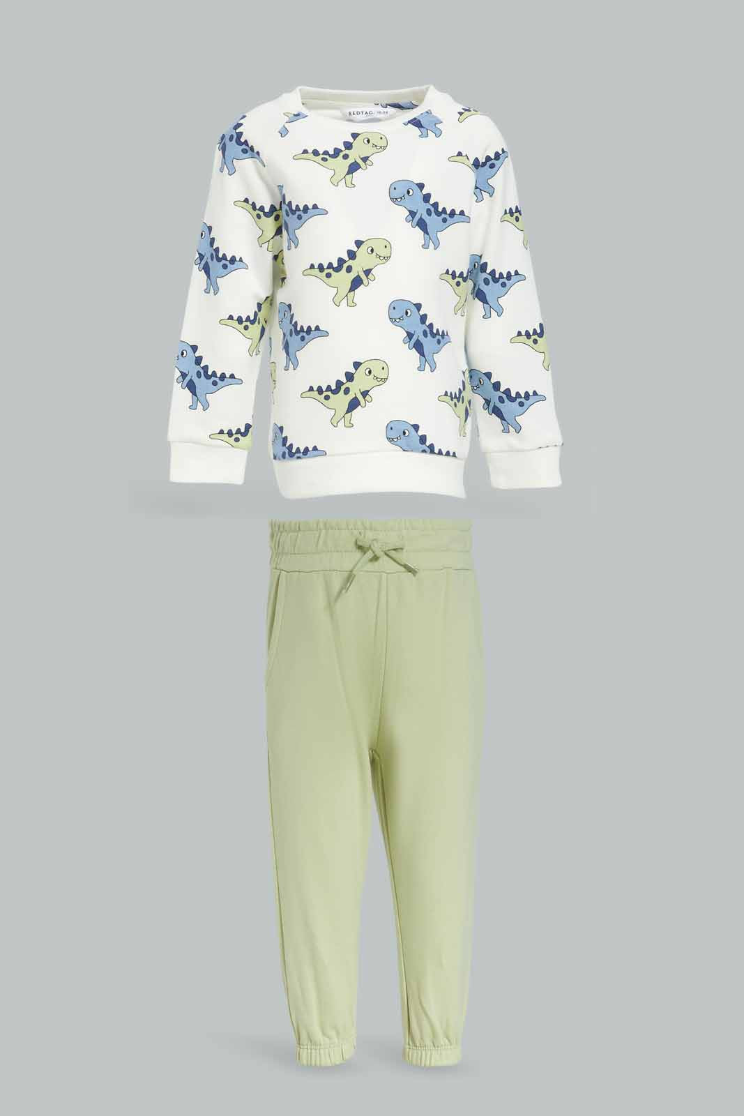 Redtag-Boys-Cream-Top-With-Green-Bottom-Dino-Aop-Crew-Jogging-Suit-Category:Jog-Sets,-Colour:Cream,-Deals:New-In,-Dept:Boys,-Filter:Infant-Boys-(3-to-24-Mths),-INB-Jog-Sets,-New-In-INB-APL,-Non-Sale,-S23A,-Section:Boys-(0-to-14Yrs)-Infant-Boys-3 to 24 Months
