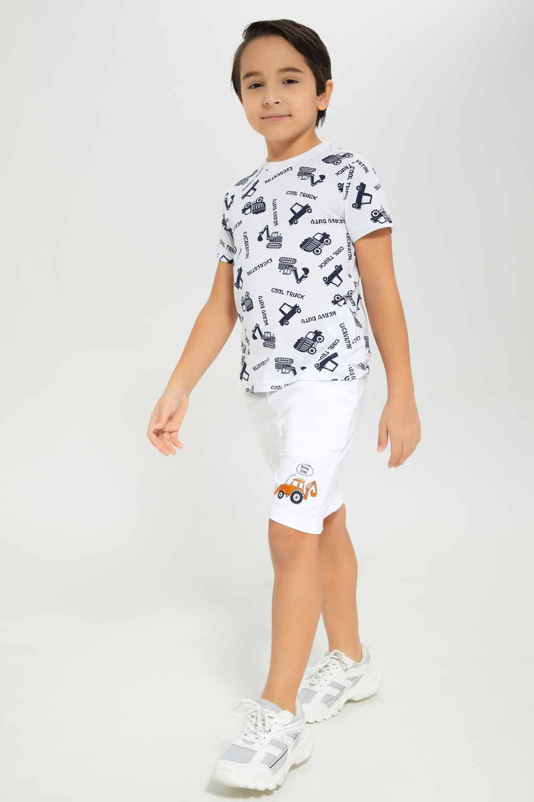 Redtag-Boys-White-Shorts-With-Print-BOY-Shorts,-Category:Shorts,-Colour:White,-Deals:New-In,-Dept:Boys,-Filter:Boys-(2-to-8-Yrs),-New-In-BOY-APL,-Non-Sale,-S23B,-Section:Boys-(0-to-14Yrs),-TBL-Boys-2 to 8 Years