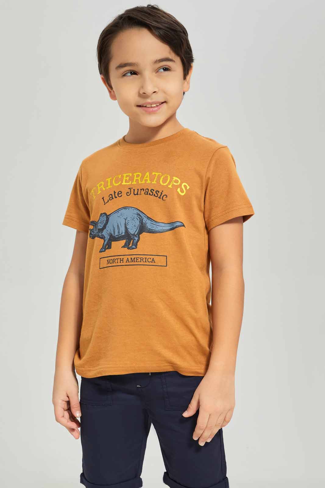 Redtag-Boys-Brown-Dino-Graphic-Short-Sleeve-T-Shirt-BOY-T-Shirts,-Category:T-Shirts,-Colour:Brown,-Deals:New-In,-Dept:Boys,-Filter:Boys-(2-to-8-Yrs),-New-In-BOY-APL,-Non-Sale,-S23A,-Section:Boys-(0-to-14Yrs),-TBL-Boys-2 to 8 Years