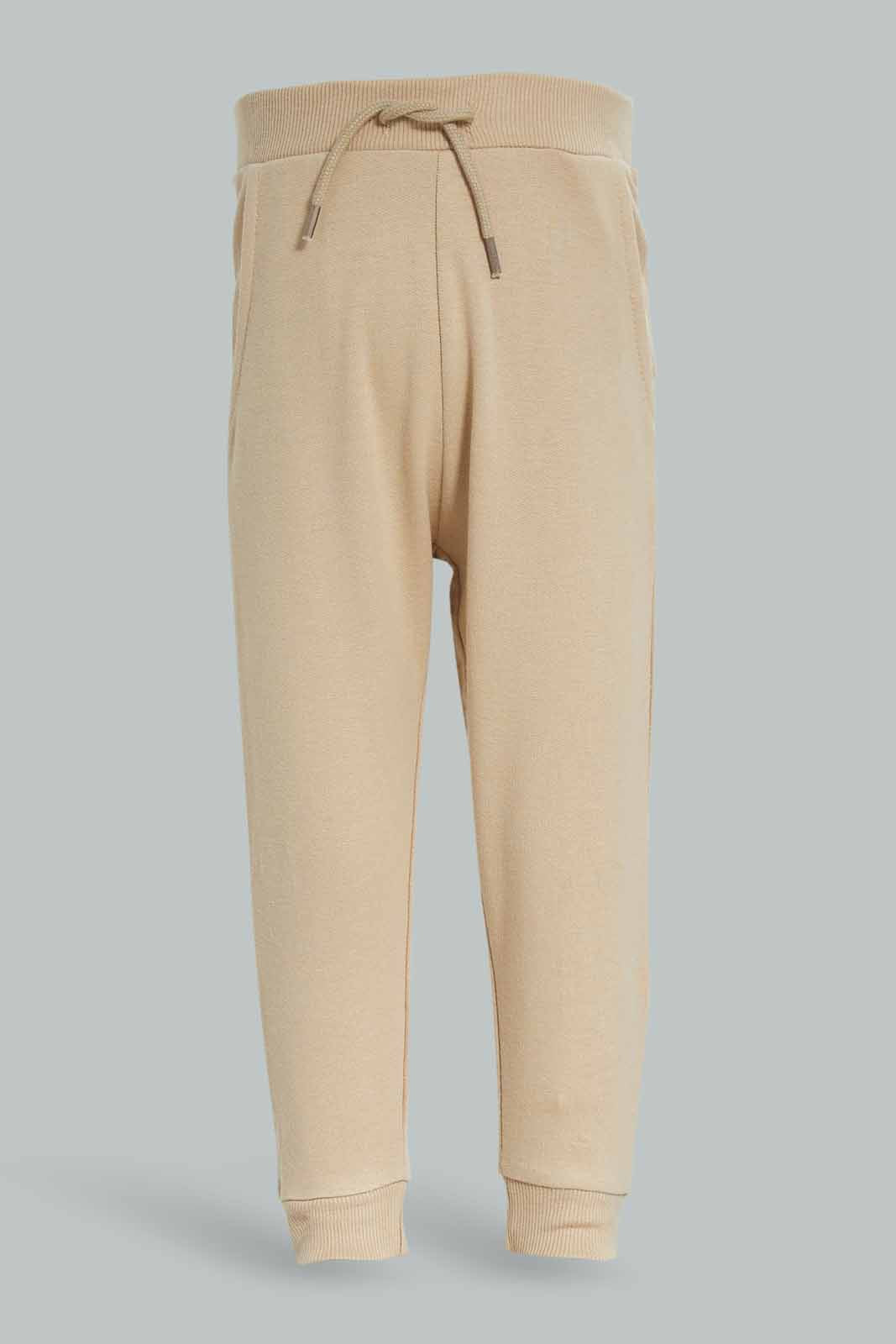 Redtag-Boys-Stone-Plain-Knit-Joggers-Category:Joggers,-Colour:Beige,-Deals:New-In,-Dept:Boys,-Filter:Infant-Boys-(3-to-24-Mths),-INB-Joggers,-New-In-INB-APL,-Non-Sale,-S23A,-Section:Boys-(0-to-14Yrs)-Infant-Boys-3 to 24 Months