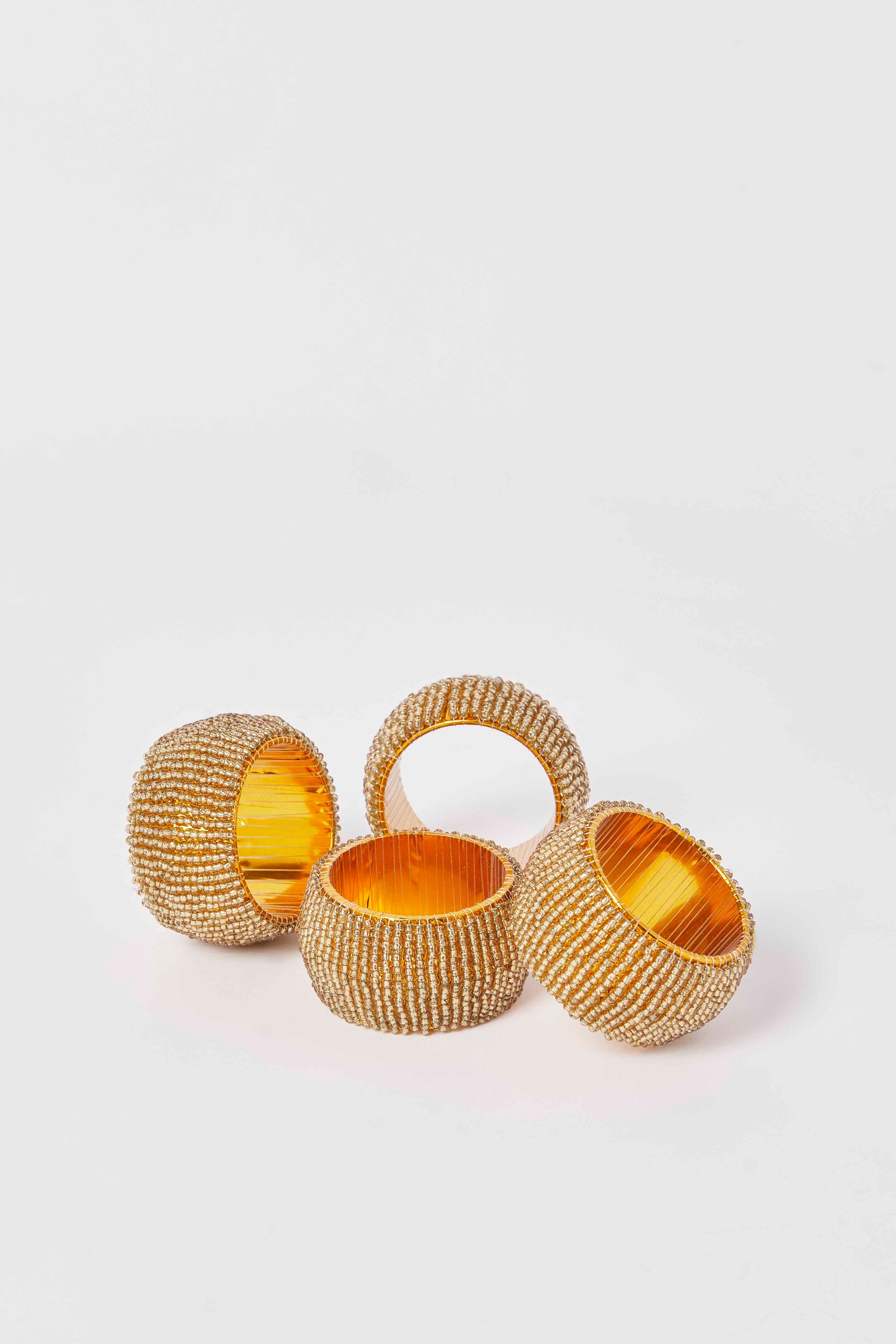 Redtag-Gold-Round-Beaded-Napkin-Ring-Set-(4-Piece)-Category:Napkins-&-Tissues,-Colour:Gold,-Deals:New-In,-Dept:Home,-Filter:Home-Dining,-HMW-DIN-Kitchen-Accessories,-New-In-HMW-DIN,-Non-Sale,-S23A,-Section:Homewares-Home-Dining-