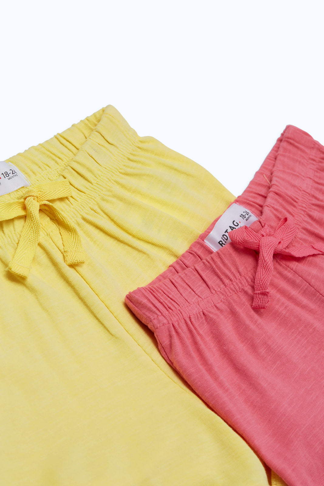 Redtag-Girls-Yellow-&-Pink-2-Pack-Shorts-Category:Shorts,-Colour:Assorted,-Deals:New-In,-Dept:Girls,-Filter:Infant-Girls-(3-to-24-Mths),-ING-Shorts,-New-In-ING-APL,-Non-Sale,-S23B,-Section:Girls-(0-to-14Yrs)-Infant-Girls-3 to 24 Months